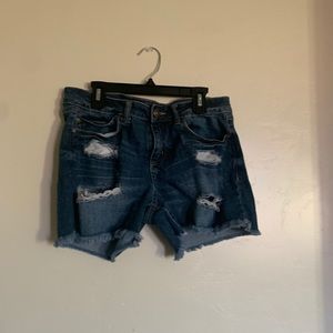 Ripped blue jean shorts
